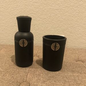 Cup or candle holder and scented stick holder.